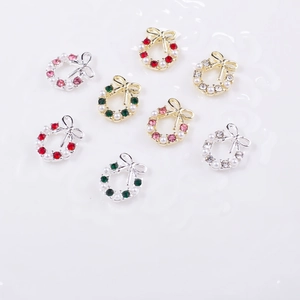 Set of 8 Christmas wreath nail art charms with pearls, rhinestones and bowknots on white