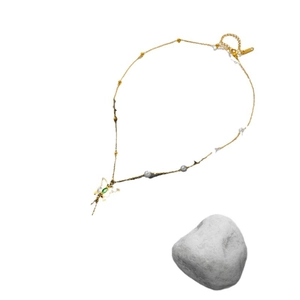 Golden butterfly necklace with green gemstone, white pearls, and thin metal link chain