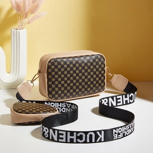 Contrast color crossbody camera bag with geometric pattern and wide adjustable strap