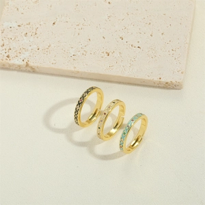 Three retro V-shaped adjustable gold rings with black white and blue enamel patterns