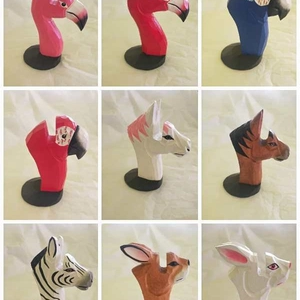 Nine piece set of colorful wooden animal head eyewear stands featuring flamingo and zebra