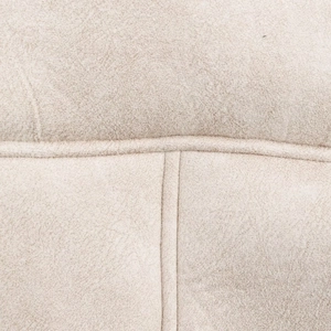 Detailed macro view showing the soft beige faux suede texture and neat stitching of the coat