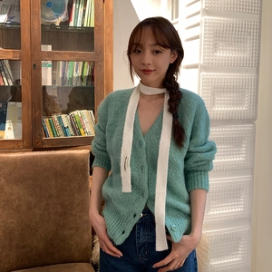 Women's slim plush scarf in white paired with a turquoise V-neck cardigan