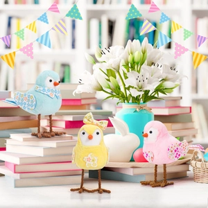 Three colorful Easter fabric bird figurines in blue, yellow, and pink for home decor