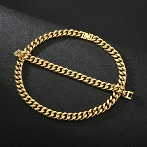 Polished gold Cuban link chain with rectangular clasp on a black textured background