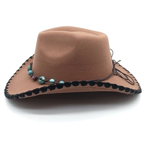Close-up of brown felt jazz hat featuring turquoise beaded band and woven edge trim