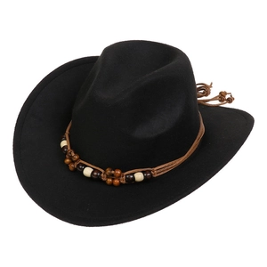 Detail of black felt western cowboy hat with intricate wooden beaded decorative band