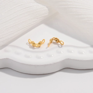 Macro detail of gold-plated S925 sterling silver jewelry connector clips for DIY designs