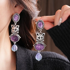 Vintage silver earrings with cat relief and purple teardrop crystal pendants