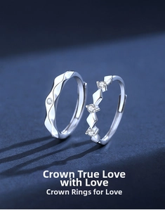 Detailed view of S925 sterling silver couple rings with geometric patterns and round stones