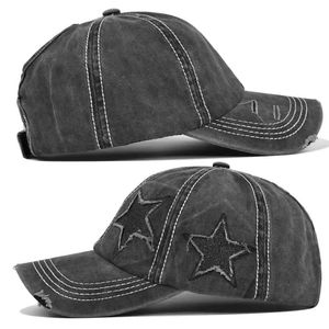 Detail of grey washed denim baseball hat featuring white contrast stitching and star patches