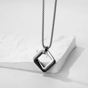 Men's minimalist necklace featuring interlocking silver and black square pendants on box chain