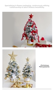 Mini Christmas tree with snow effect, gold ornaments and red stars in decorative base