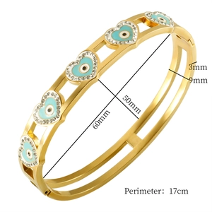 Golden Evil Eye heart bangle with blue crystals and 17cm circumference for women