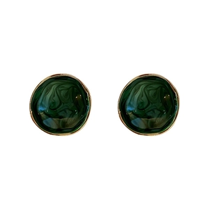 Retro dark green marble texture round earrings with golden metal edges on white background