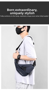 Water-resistant dark blue crossbody chest bag with adjustable strap worn by model
