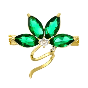 Golden flower brooch featuring emerald green marquise gems and white zircon accents