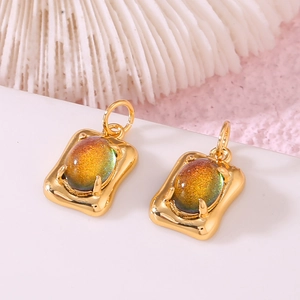 Detail of 14K gold-plated charms with oval rainbow gemstones for DIY jewelry making
