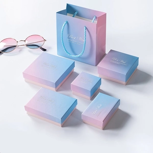 Pink and blue gradient jewelry gift boxes with matching bags and gold lettering
