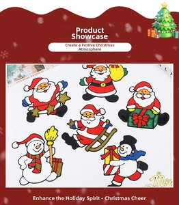 Macro detail of Christmas Santa and snowman window decals with festive gold glitter finish