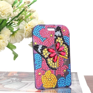 Detail of 5D DIY diamond painting luggage tag with colorful butterfly rhinestones