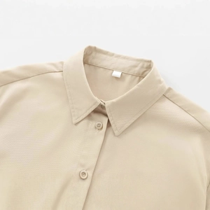 Classic beige twill shirt with button-down collar and premium cotton texture details