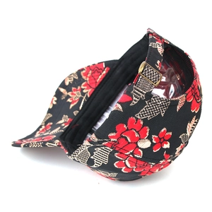 Detail of adjustable metal buckle and vintage floral embroidery on the hip hop baseball cap