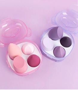 Detailed top view of 8 soft beauty sponges in pink and purple storage boxes