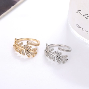 Olive leaf 18K gold plated open rings with micro-pave zircons on a white background