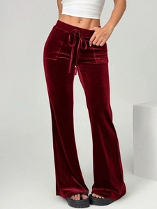Elegant burgundy velvet flare pants with drawstring waist for a slim fit autumn look