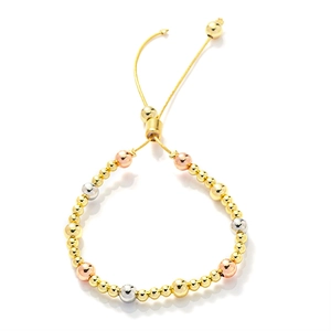 Detail of adjustable beaded bracelet featuring gold, silver, and rose gold copper beads