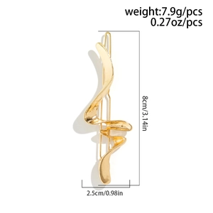 Detail showing irregular gold liquid metal hair clip with 8cm length and 7.9g weight
