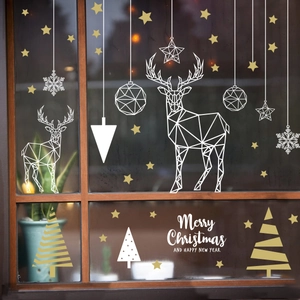 Geometric Christmas reindeer and snowflake window decals in gold and white tones