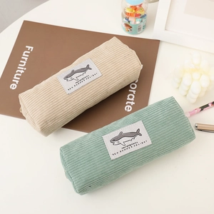 Corduroy shark pencil cases in beige and green for stationery storage and organization