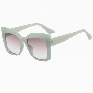 Close-up of retro jelly blue square sunglasses with thick temples and gradient lenses