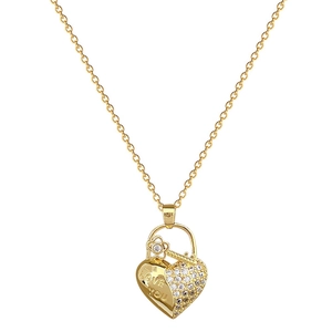 Luxurious gold heart and key necklace with crystals and 'LOVE YOU' engraving on white background