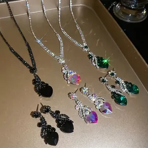 Luxurious sparkling heart pendant necklace and earrings set in multiple elegant colors