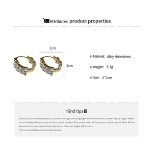 Detail showing gold alloy hoop earrings with rhinestones dimensions 2x2cm and weight 5.3g