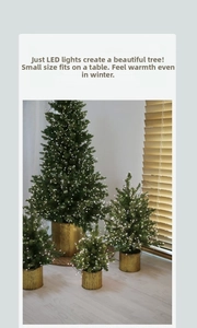 Mini LED Christmas tree detail with warm light beads and textured golden metal base