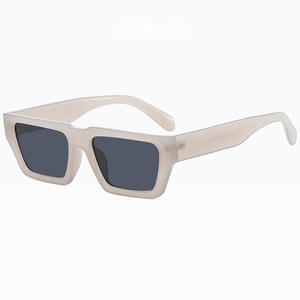 Close-up of retro square sunglasses in translucent jelly gray with thick acetate frames