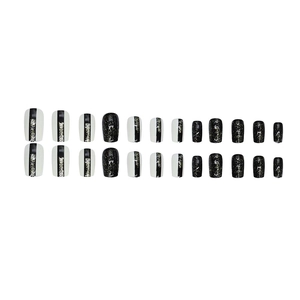 Medium square nail tips set with black and white two-tone design and silver glitter accents