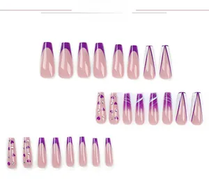 Detail of purple French press on nails with white heart art and sparkling rhinestones