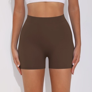 Close-up of high-waist peach-lift yoga shorts in dark coffee with tummy control fit