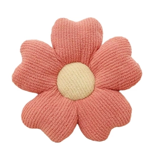 Pink and yellow five-petal flower plush cushion with striped corduroy texture on white background