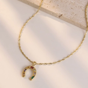 Golden horseshoe pendant necklace with colorful zircon stones on thin water wave chain
