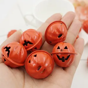 Halloween pumpkin bell with smiling face in bright orange painted metal finish