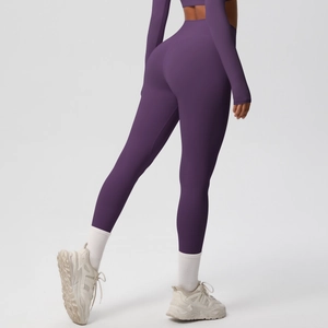 Rear view of dark purple high-waisted seamless yoga leggings with push-up effect