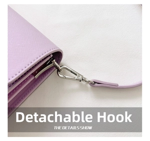 Detail of lavender crossgrain leather bag with detachable silver metal hook and strap