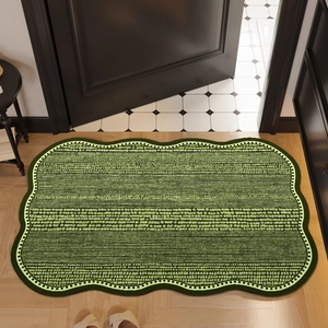 Green diatom mud bath mat with scalloped edges and woven texture for bathroom