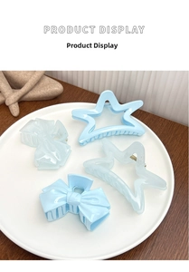 Detail view of 4-piece set featuring ice mint blue star and bow hair claw clips